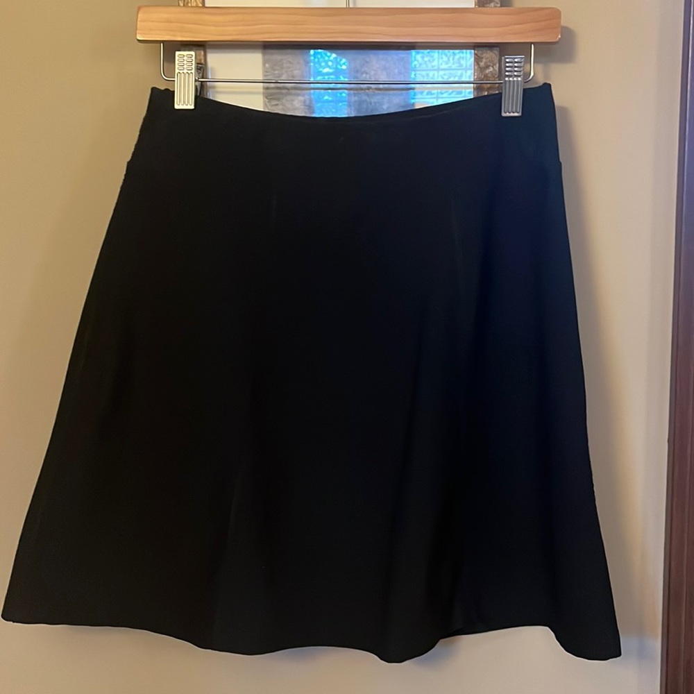 Sporty black Lucy knee high skirt.